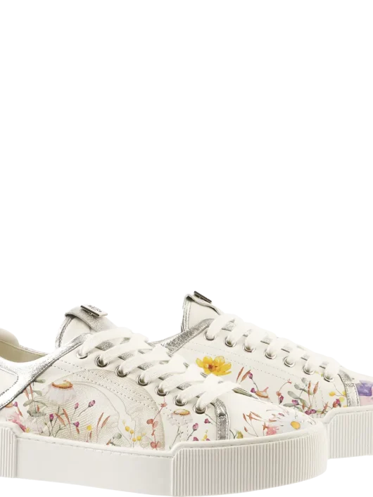 Zapatilla blanca de Högl con estampado floral y detalles plateados – vista lateral izquierda